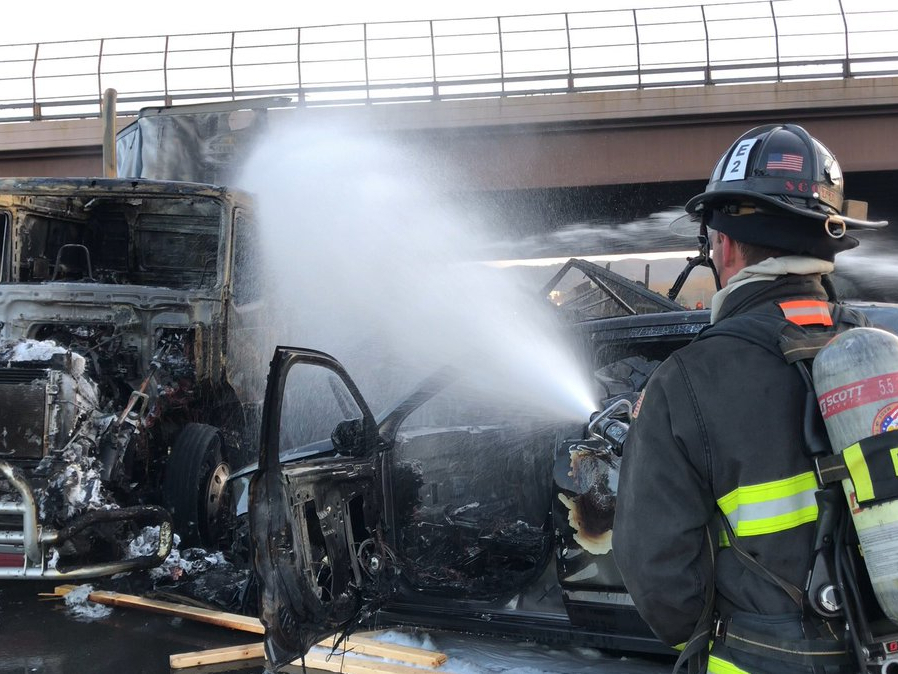 caption: This April 25, 2019 file photo provided by West Metro Fire Rescue shows a firefighter working the scene of a deadly pileup involving over two dozen vehicles near Denver. Truck driver Rogel Lazaro Aguilera-Mederos, 26, has been sentenced to 110 years in prison for causing the accident.