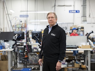 caption: Dan Digre, CEO of MISCO, on the factory floor in St. Paul, Minn. on May 18, 2023.