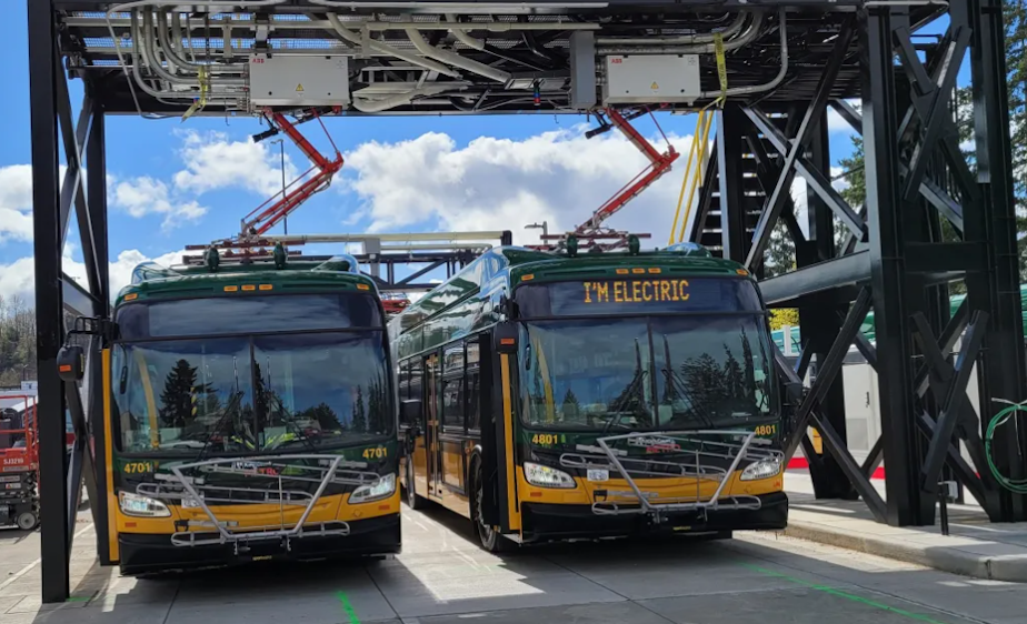 caption: Batteries being charged for two of King County Metro's electric buses.