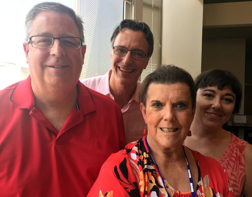 caption: Through the smokey haze and in an air conditioned building, Chris Vance, Cathy Allen, Bill Radke and Erica Barnett.