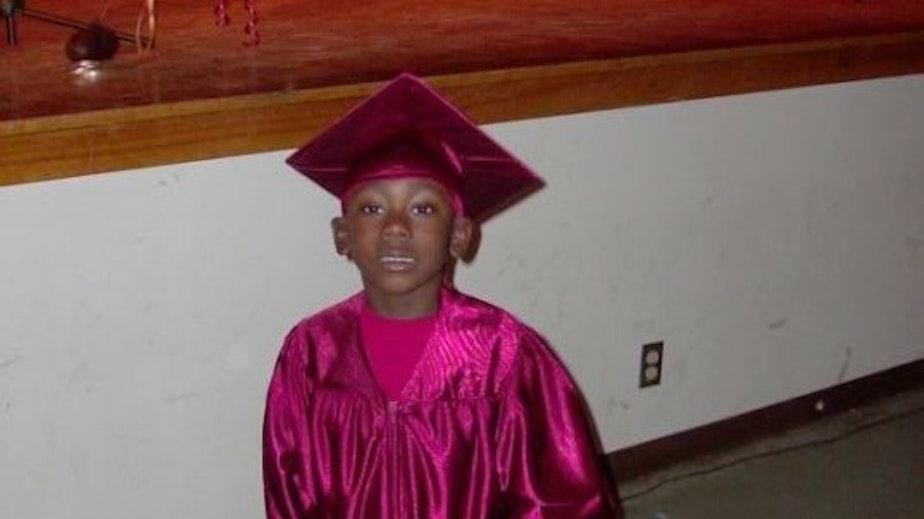 caption: The author at his kindergarten graduation. He used to be a "crybaby" as a child, according to his mother, Tamera Cook.