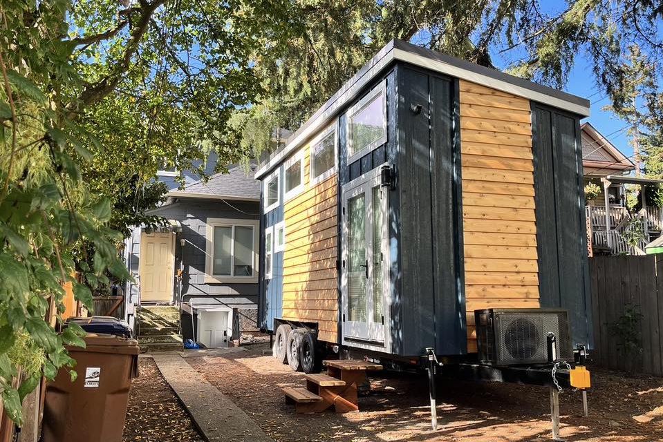 caption: Jon Urlie's tiny house on wheels in Tacoma's Hilltop neighborhood. He rents space in someone's driveway.