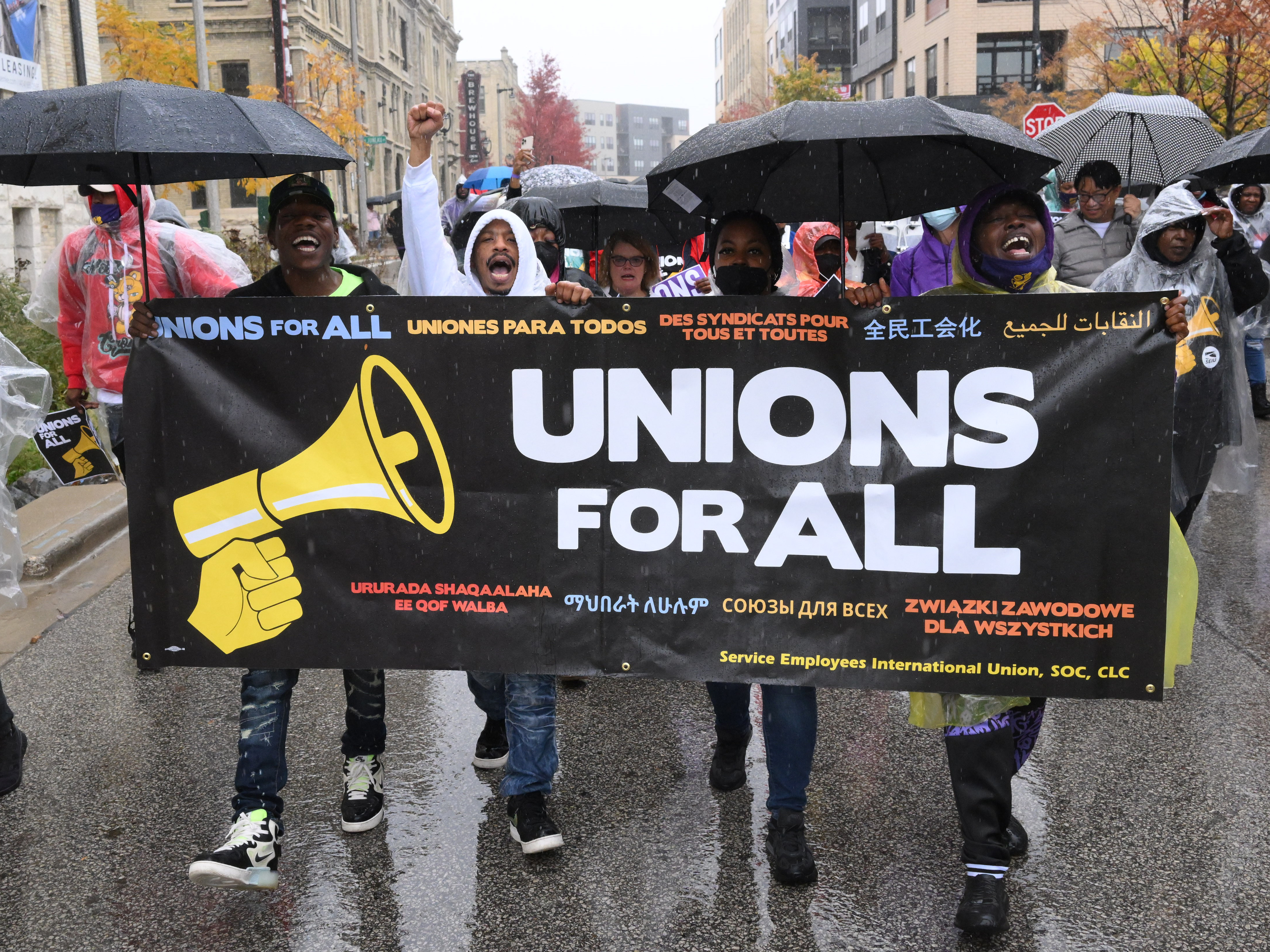 caption: Workers in Milwaukee, Wisconsin, take to the streets in Milwaukee, Wisconsin.