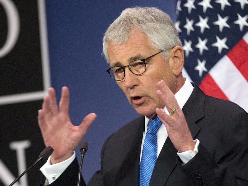 caption: Chuck Hagel, then U.S. secretary of defense, speaks during a media conference at NATO headquarters in Brussels in 2015.