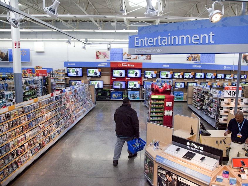 caption: In this Dec. 15, 2010 file photo, a view of the entertainment section of a Wal-Mart store is seen in Alexandria, Va. Walmart is taking down all signs and displays from its stores that depict violence, following a mass shooting at its El Paso, Texas location that left 22 people dead. (AP Photo, File)
