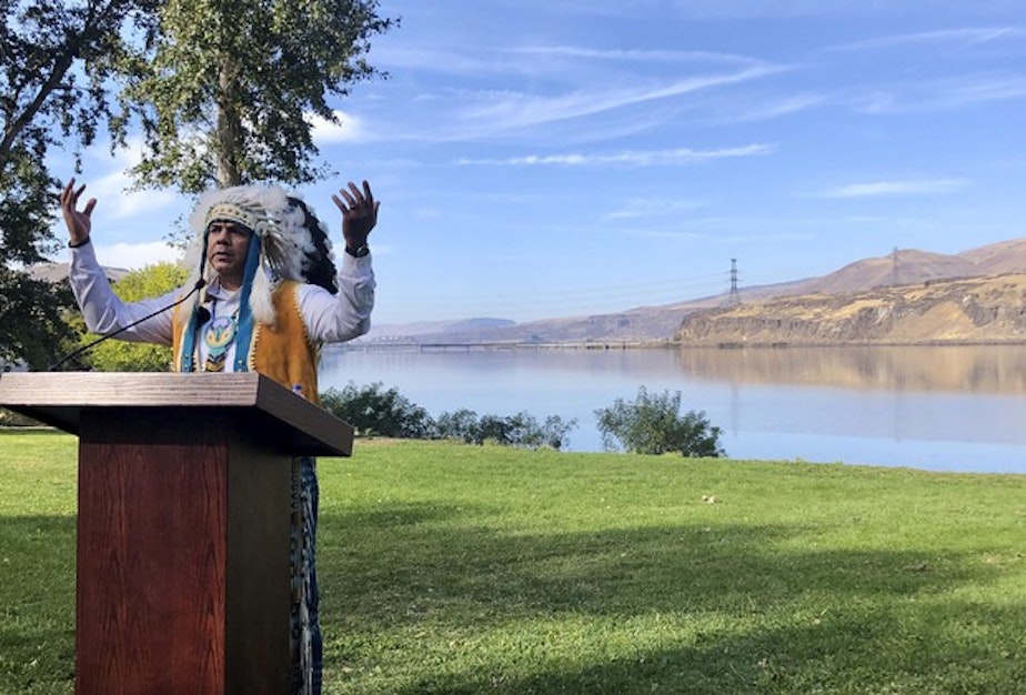 caption: <p>JoDe Goudy, chairman of the Yakama Nation, speaks with the Columbia River in the background near The Dalles, Oregon, on Monday, Oct. 14, 2019, where Celilo Falls, an ancient salmon fishing site was destroyed by the construction of the Dalles Dam in the 1950s.&nbsp; </p>