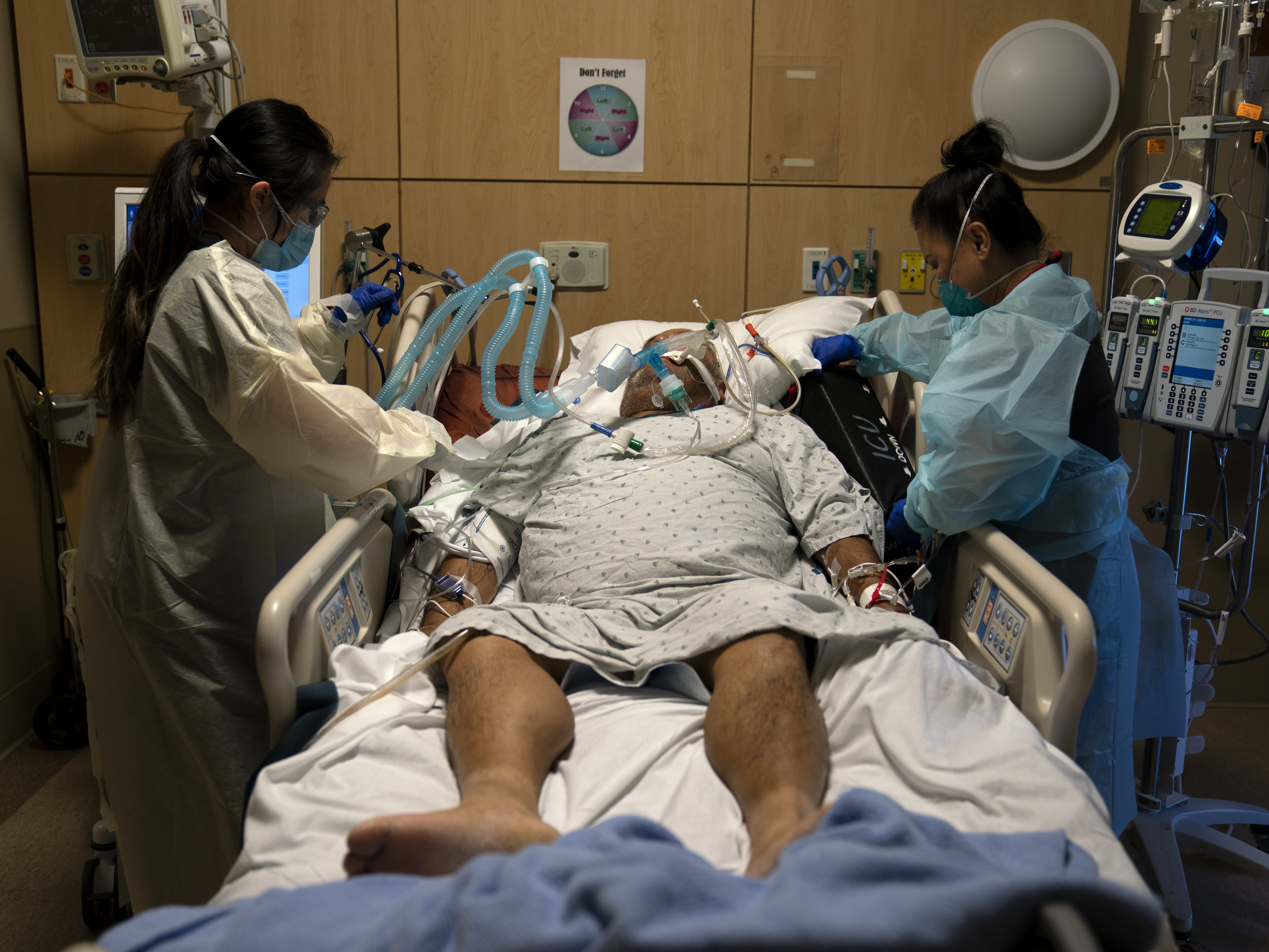 caption: Hospitalizations and deaths from the coronavirus continue to increase this month, with the number of Americans who died in a single day from the illness surpassing 3,600.