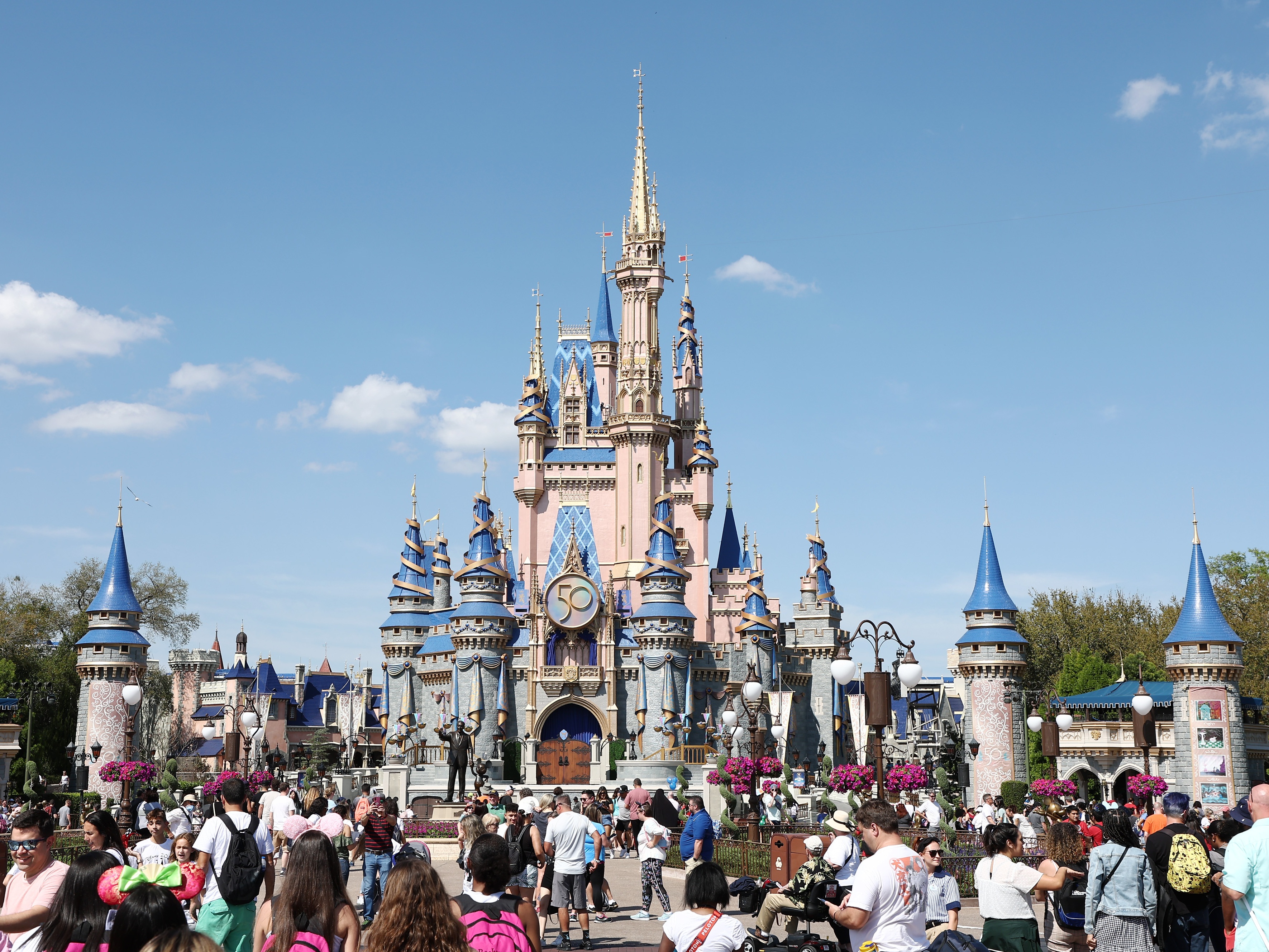caption: A general view of Cinderella's Castle at Walt Disney World Resort in March 2022 in Lake Buena Vista, Fla.