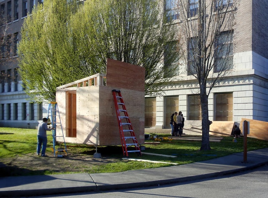 caption: The Low Income Housing Institute has filed for a Seattle permit to open a camp with tiny houses, much like the one above, and tents.