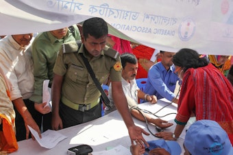 caption: A man gets tested for diabetes at an event in Dhaka, Bangladesh, for World Diabetes Day in 2019.