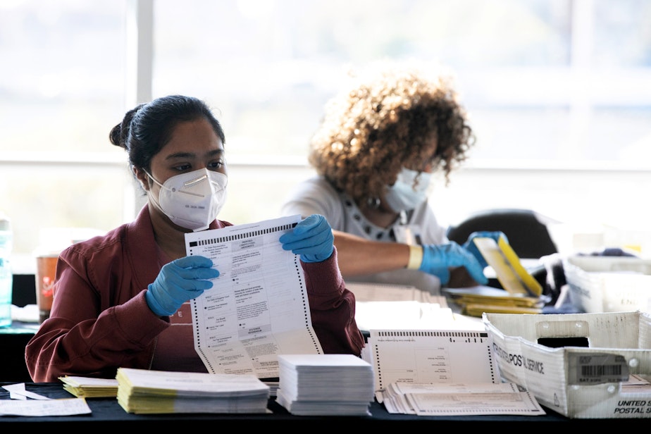 caption: Election workers count Fulton County ballots at State Farm Arena on November 4, 2020 in Atlanta, Georgia. (Jessica McGowan/Getty Images)