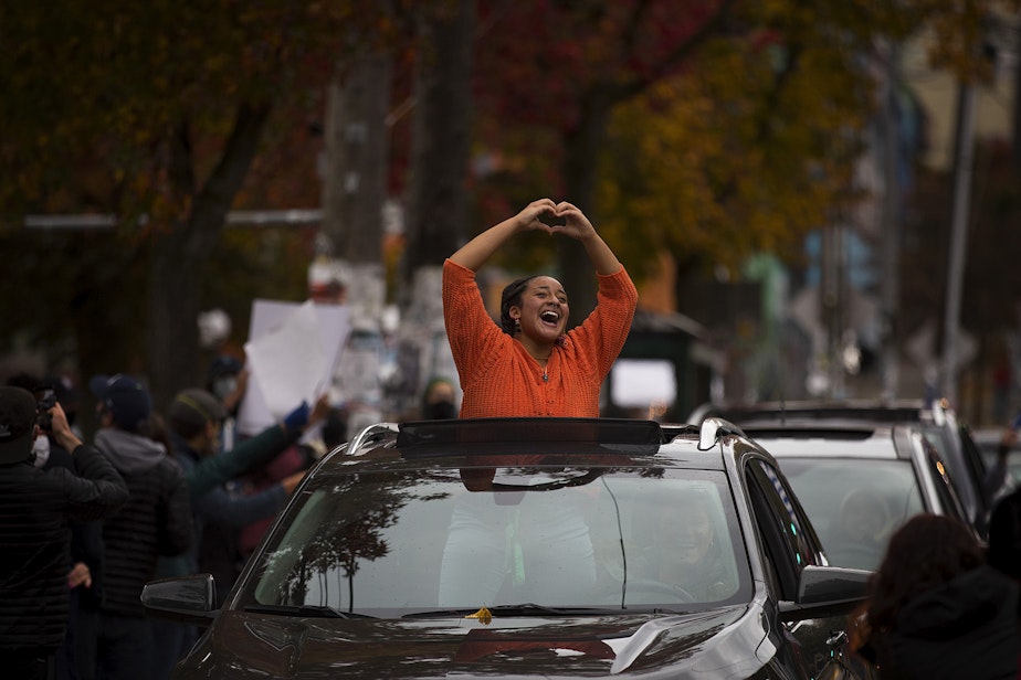 caption: An impromptu car parade and celebration took place shortly after Joe Biden was officially named the president elect on Saturday, November 7, 2020, near the intersection of 10th Avenue and East Pine Street in Seattle.
