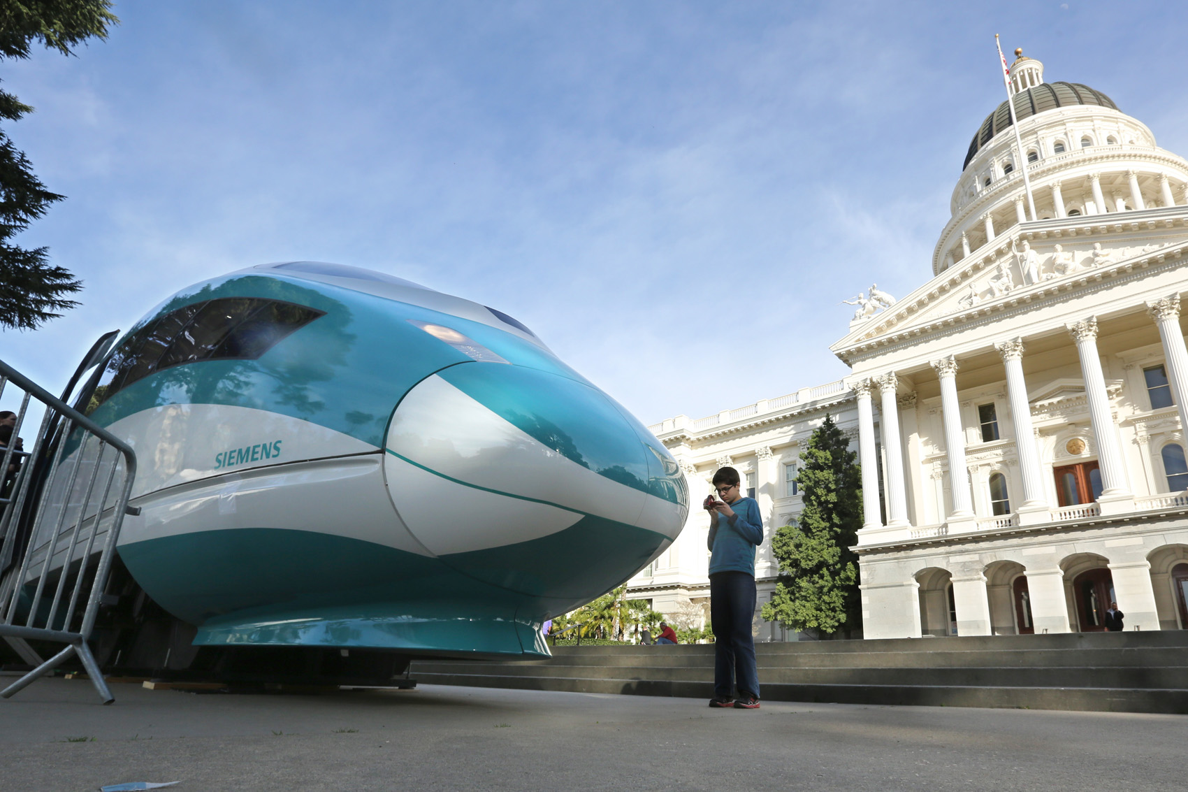 caption: A full-scale mock-up of a high-speed train is displayed at the Capitol in Sacramento, Calif. (Rich Pedroncelli/AP)