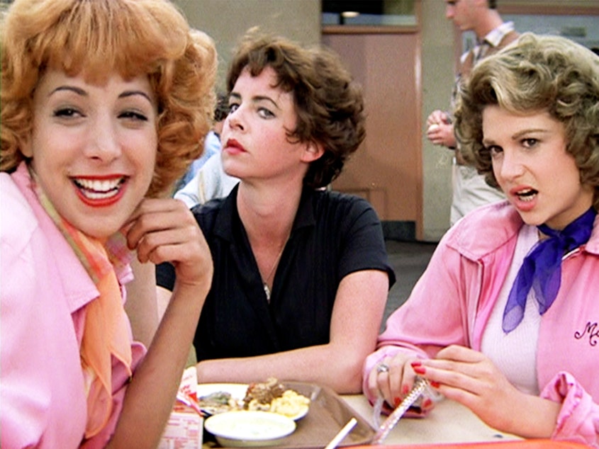 caption: Rizz is the word of year for 2023, according to the publishers of the Oxford English Dictionary. The term deals with charisma and charm — and other rizzes are available, such as Stockard Channing, center, seen here as Betty "Rizz" Rizzo in the 1978 film <em>Grease</em>.