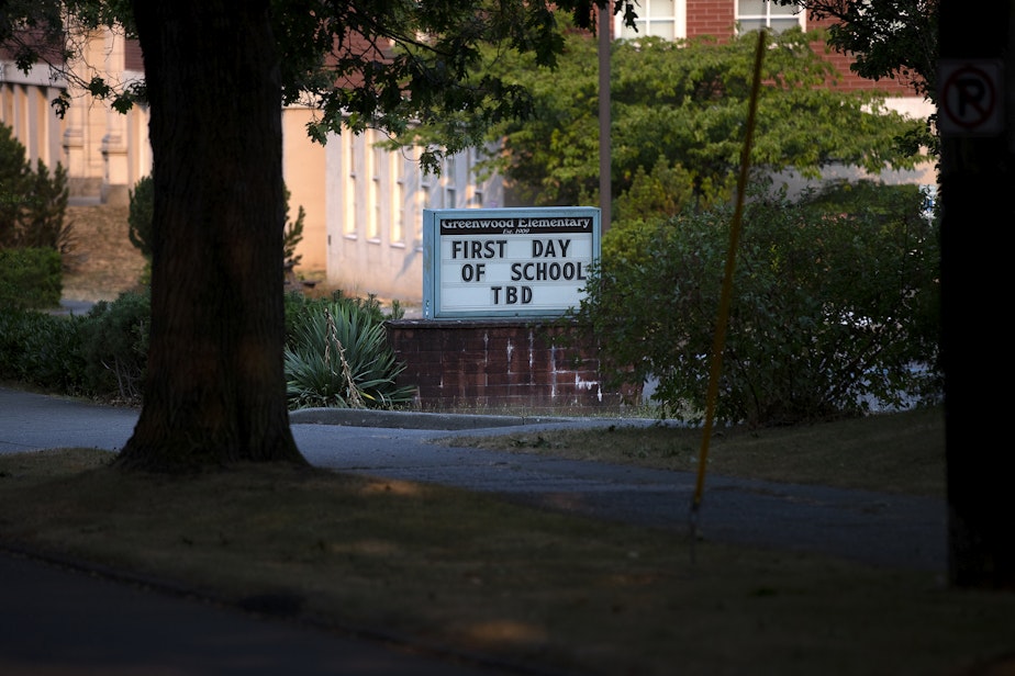 caption: A sign outside of Greenwood Elementary School reads, ‘first day of school TBD,’ as educators continue to strike on Friday, September 9, 2022, along Northwest 80th Street in Seattle. 