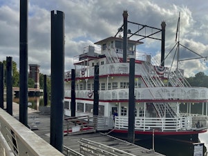 caption: The Harriott II riverboat sits at the Riverfront dock in Montgomery, Ala. Three white men have been charged with assault for attacking the ship's co-captain last Saturday, which turned into a brawl along racial lines, as seen in dozens of videos online.