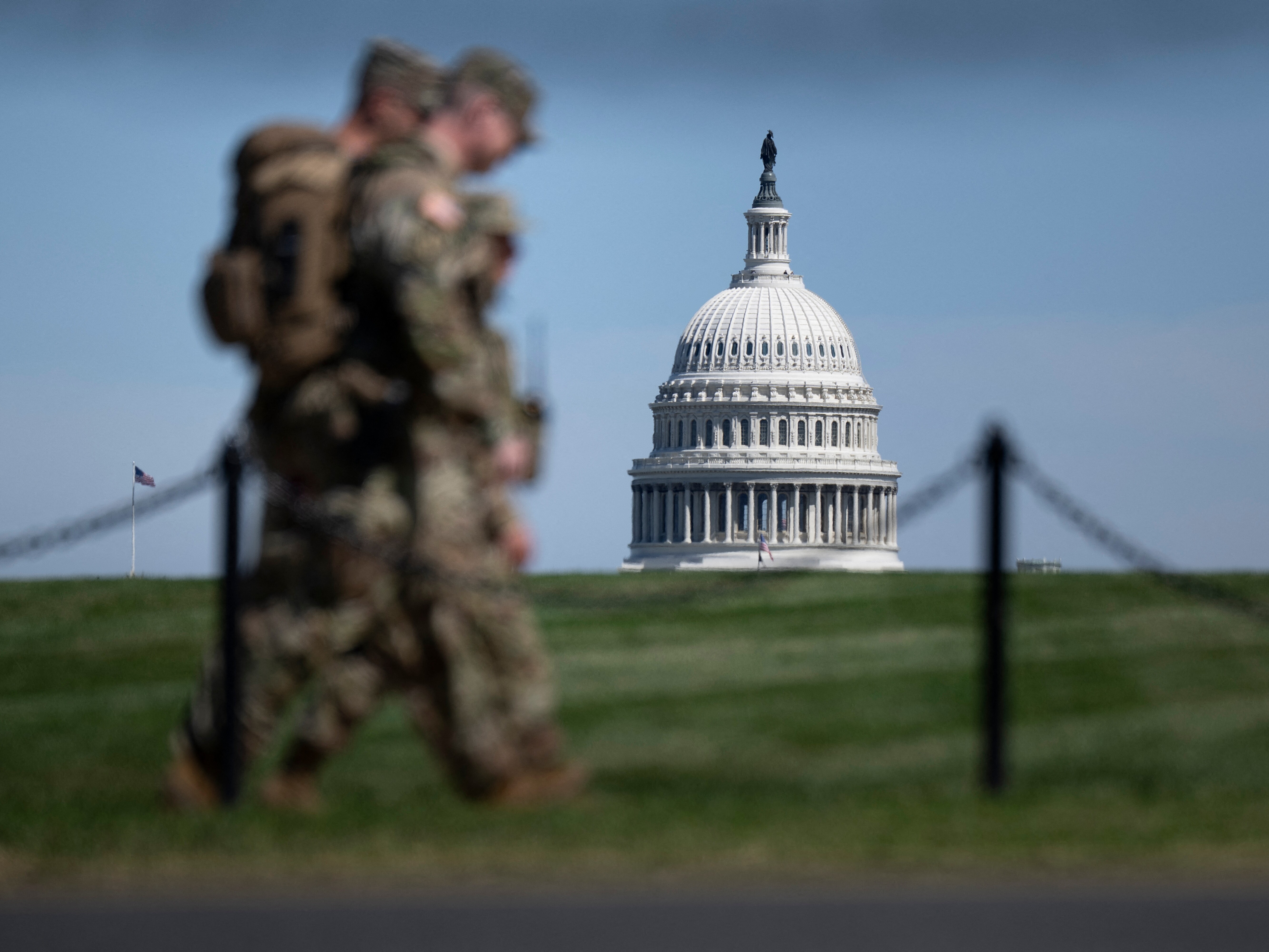 caption: The U.S. Capitol is seen as members of the National Guard patrol the National Mall in Washington, D.C. earlier this month. A new NPR-Ipsos poll finds Americans are concerned about crime, but don't broadly support President Trump's deployment of the National Guard to police U.S. cities.