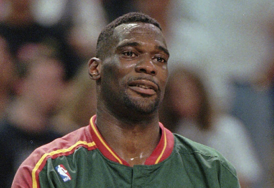 caption: Shawn Kemp of the Seattle SuperSonics looks on in the final moments of their 96-89 win over the Sacramento Kings in the first round NBA playoffs, Tuesday April 30, 1996, at Arco Arena in Sacramento, Calif. 