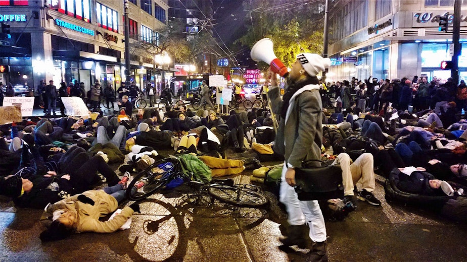 caption: Protesters in response to the Ferguson and Eric Garner grand jury decisions converge on downtown Seattle on Dec. 4, 2014.
