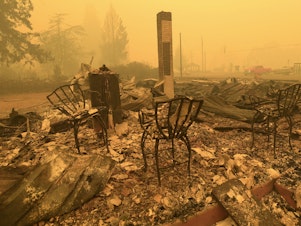 caption: Chairs stand at the local post office in the aftermath of a fire in Gates, Ore., on Sept 9, 2020. An Oregon jury on Tuesday awarded $85 million to nine victims of wildfires that ravaged the state in 2020, in the latest trial faced by utility PacifiCorp over its liability in the deadly blazes.