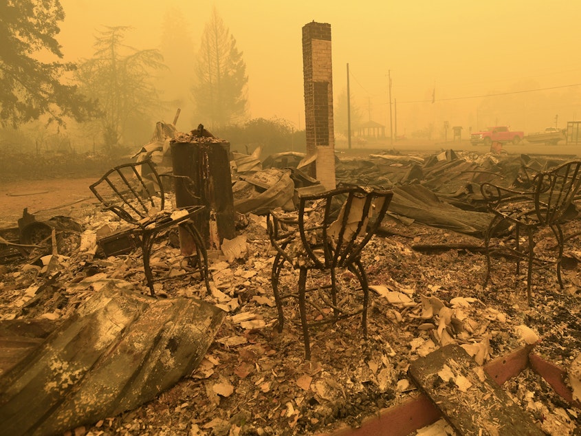 caption: Chairs stand at the local post office in the aftermath of a fire in Gates, Ore., on Sept 9, 2020. An Oregon jury on Tuesday awarded $85 million to nine victims of wildfires that ravaged the state in 2020, in the latest trial faced by utility PacifiCorp over its liability in the deadly blazes.