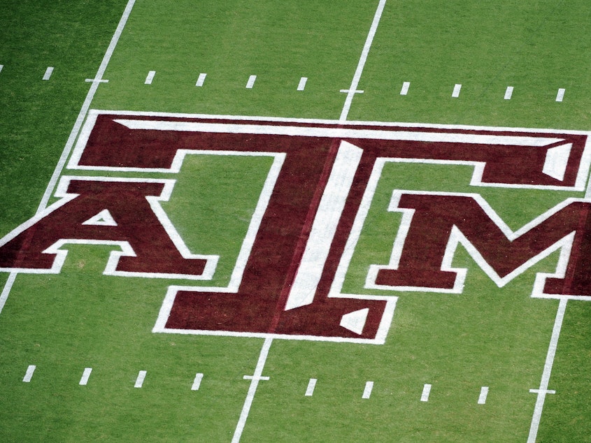 caption: Texas A&M University announced Friday, July 21, 2023, that its school president has resigned after a Black journalist's celebrated hiring at one of the nation's largest campuses unraveled over pushback of her diversity and inclusion work. Here, the Texas A&M logo on Kyle Field is seen before an NCAA college football game against Florida, in College Station, Texas, Sept. 8, 2012.