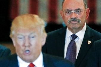 caption: Allen Weisselberg, the Trump Organization's longtime chief financial officer, looks on as then-U.S. Republican presidential candidate Donald Trump speaks during a 2016 news conference at Trump Tower in New York City.