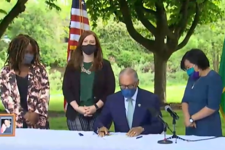 caption: Gov. Jay Inslee signed into law a new capital gains tax and an expanded version of the state's Working Families Tax Exemption which has never before been funded.