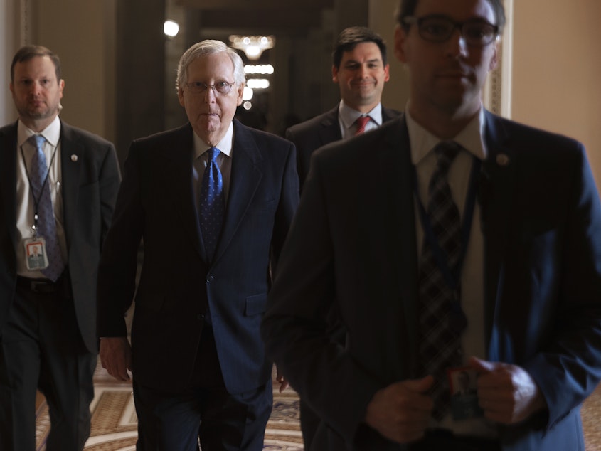 caption: Senate Majority Leader Mitch McConnell laughed Monday when asked about Democrats' decision to delay sending articles of impeachment to his chamber. The tension comes amid debate over whether the trial will include witnesses.