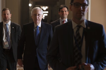 caption: Senate Majority Leader Mitch McConnell laughed Monday when asked about Democrats' decision to delay sending articles of impeachment to his chamber. The tension comes amid debate over whether the trial will include witnesses.