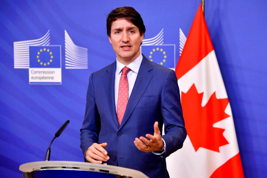 caption: Canadian Prime Minister Justin Trudeau delivers a media statement at EU headquarters in Brussels, Wednesday, March 23, 2022. 