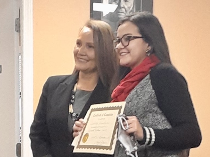 caption: Quinault Nation Chief Judge Leona Colegrove (left) celebrates a Wellness Court graduation with Samantha Windham in December 2021. 