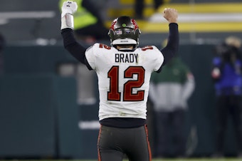 caption: Tampa Bay Buccaneers quarterback Tom Brady reacts after winning the NFC championship against the Green Bay Packers in Green Bay, Wis., on Sunday. The Buccaneers will meet AFC champions Kansas City Chiefs Feb. 7 in Super Bowl LV.