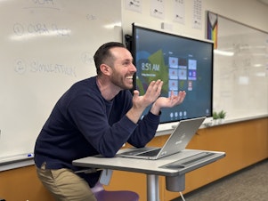 caption: Sean Mullin, a social studies teacher at Lake Washington High School, was an early adopter of artificial intelligence. He thinks it could be a solution to help with teacher burnout.