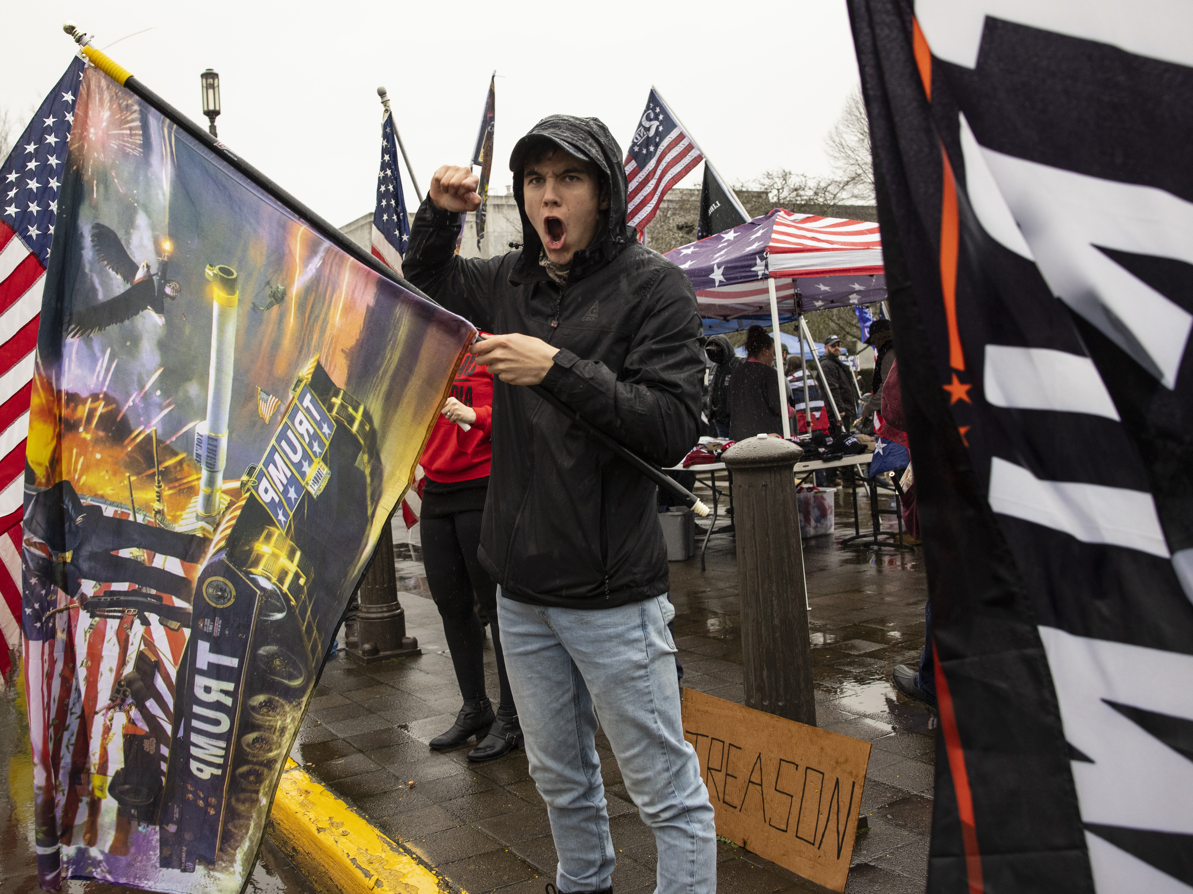 caption: Seven Oregon counties have now voted in favor of a secession movement, which calls for leaving the blue state to join red-state Idaho. Here, a man yells at the Capitol in Salem on Jan. 6, protesting in support of former President Donald Trump.