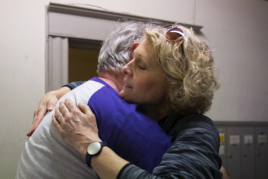 caption: Jerri Clark, right, hugs Todd Crooks, before packing up her son Calvin's apartment on Friday, March 22, 2019, in Seattle.