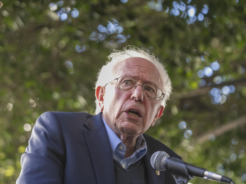 caption: Sen. Bernie Sanders addresses Unite Here Local 11 workers protesting outside of Figueroa Hotel in downtown Los Angeles on Friday. Authorities are investigating a blaze that was set at his Burlington, Vt., office that same day.