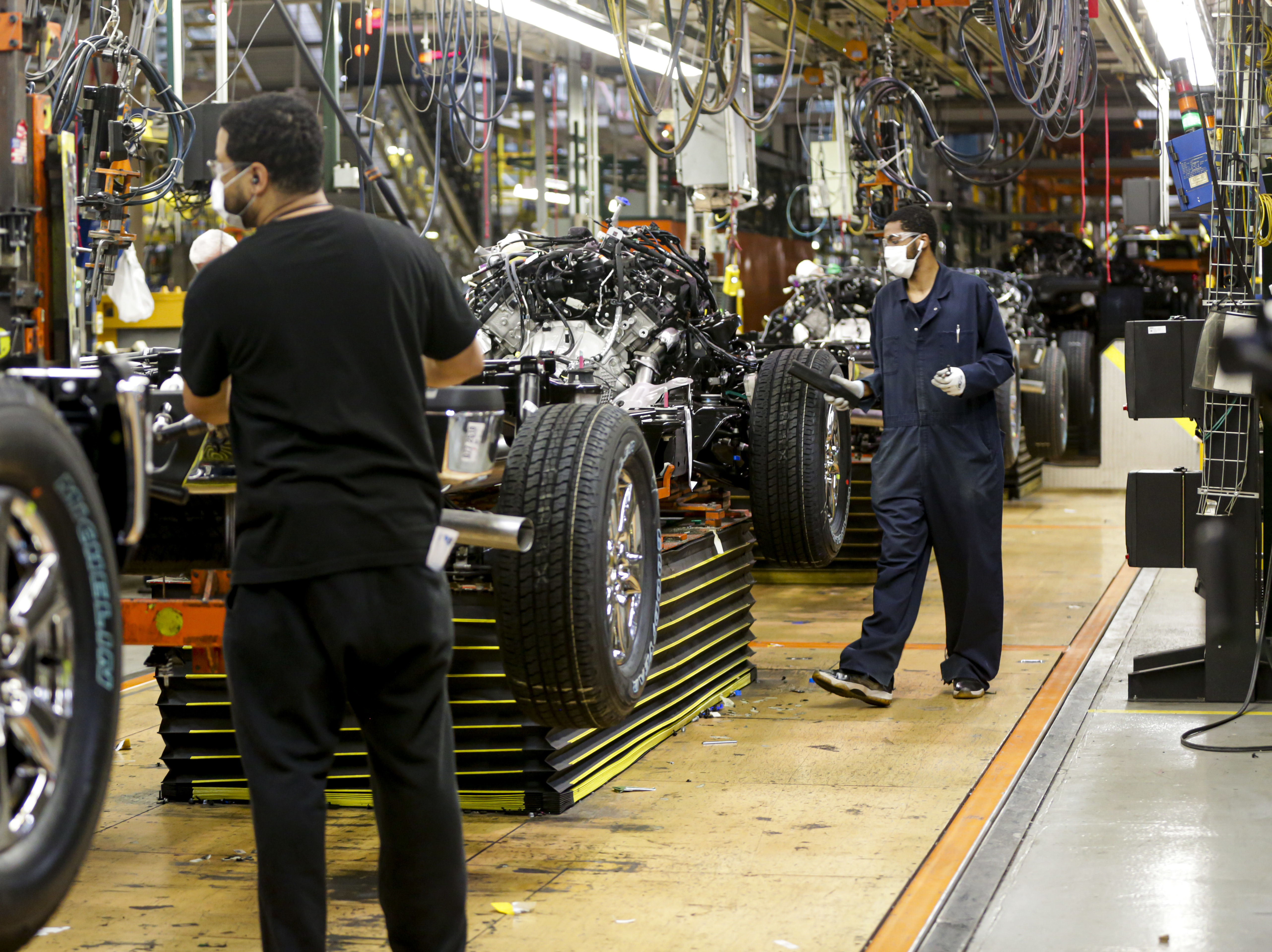 caption: Ford brought 71,000 workers back on Monday in North America.