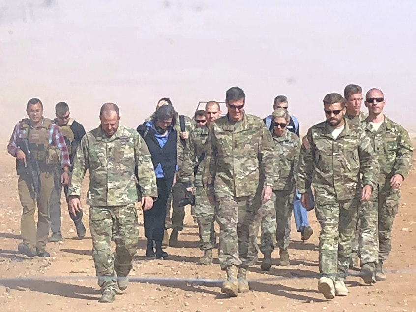 caption: U.S. Gen. Joseph Votel (center), the top U.S. commander for the Middle East, visited a military outpost at al-Tanf in southern Syria, where the U.S. trains Syrian opposition forces, in October. President Trump is planning to withdraw the U.S. forces from Syria, according to a Pentagon official.