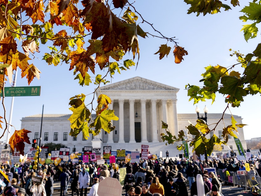 caption: Abortion rights advocates and abortion rights opponents demonstrate in front of the U.S. Supreme Court, Wednesday, Dec. 1, 2021, in Washington, as the court hears arguments in a case from Mississippi, where a 2018 law would ban abortions after 15 weeks of pregnancy, well before viability.