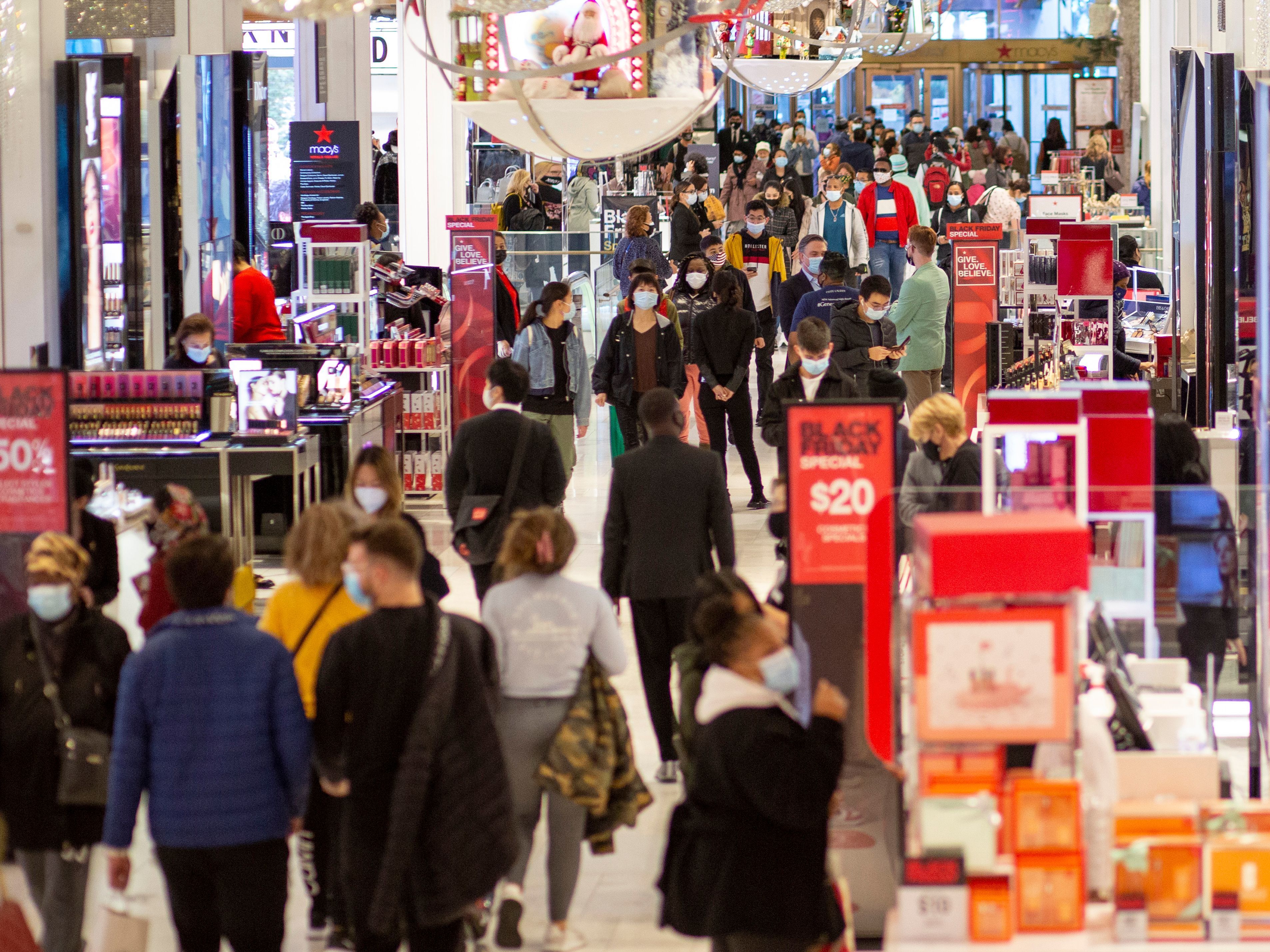 caption: People shop at Macy's in New York on Black Friday, Nov. 27.