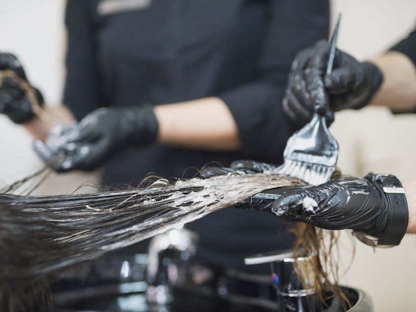 caption: Hair dyes and straighteners contain chemicals that are being studied for their health effects.