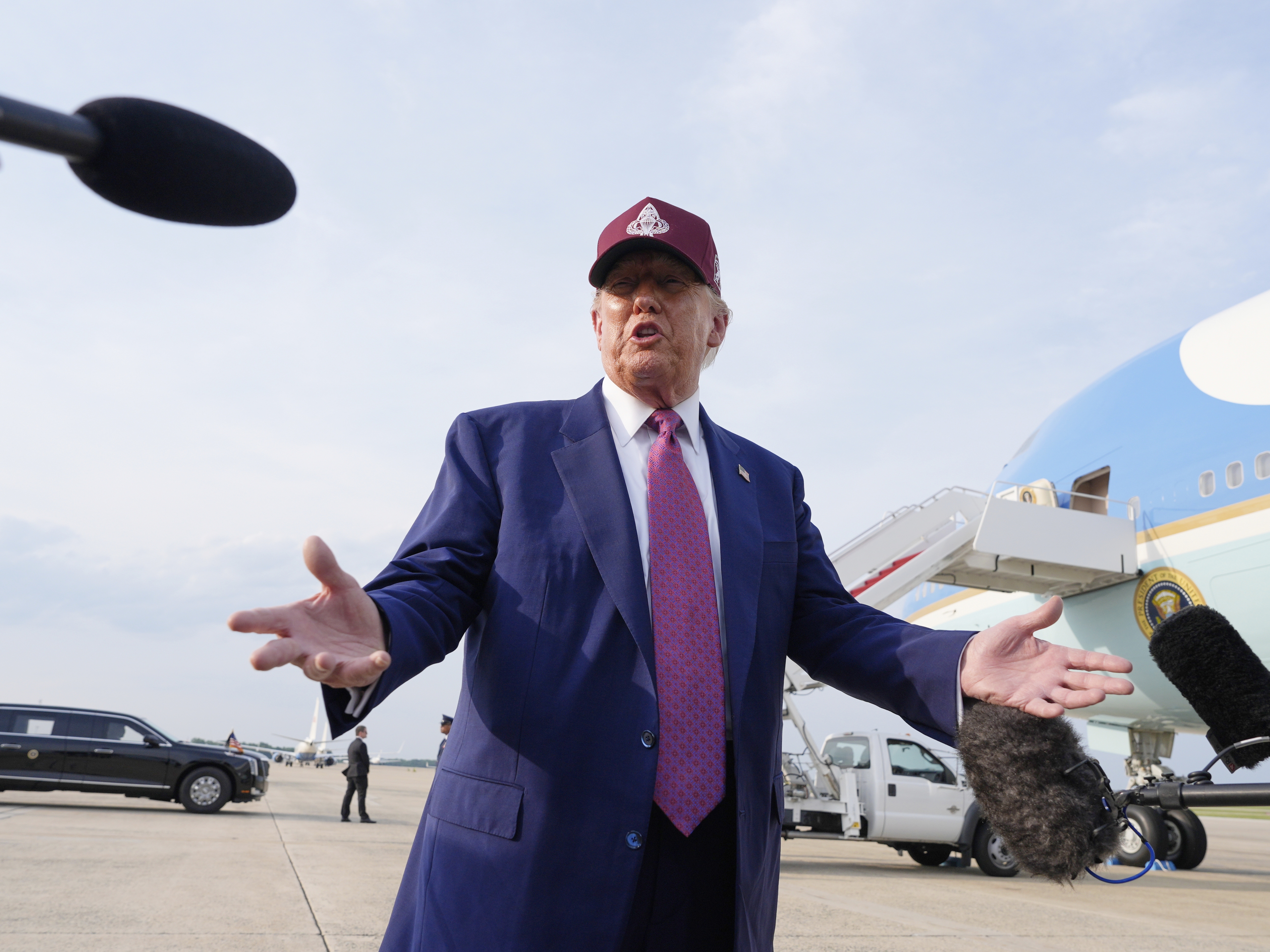 caption: President Trump speaks to reporters after arriving on Air Force One on Tuesday at Joint Base Andrews, Md.