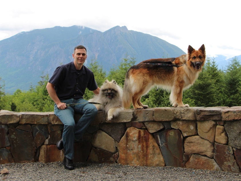 caption: Co-Founder Dr. Matt Kaeberlein with his dogs Chloe and Dobby.