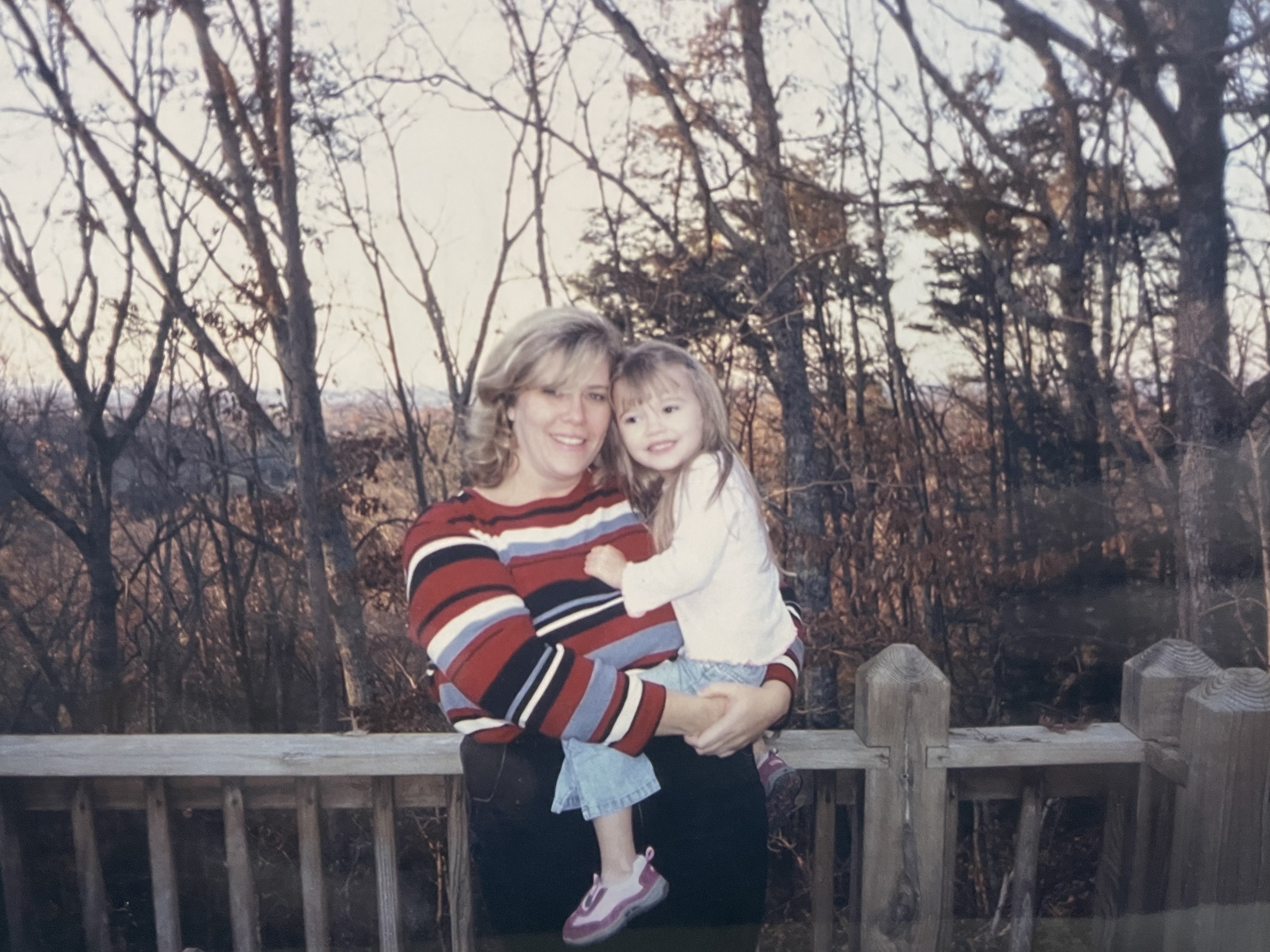 caption: Sabrina Kronk and her daughter Katie. During a time when Kronk said she was worried about finances, a group of mechanics helped the family of two out by providing free parts and labor to fix their SUV.