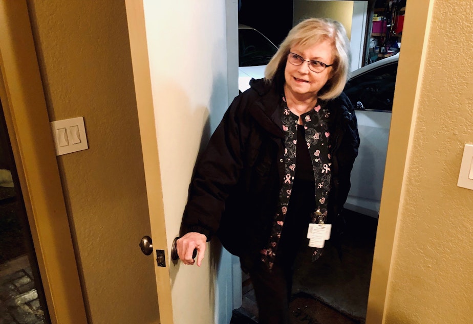 caption: 6:27 AM, March 16, 2020. Bellevue, WA nurse Kathy Leong heads out the door to go work during the COVID-19 pandemic.