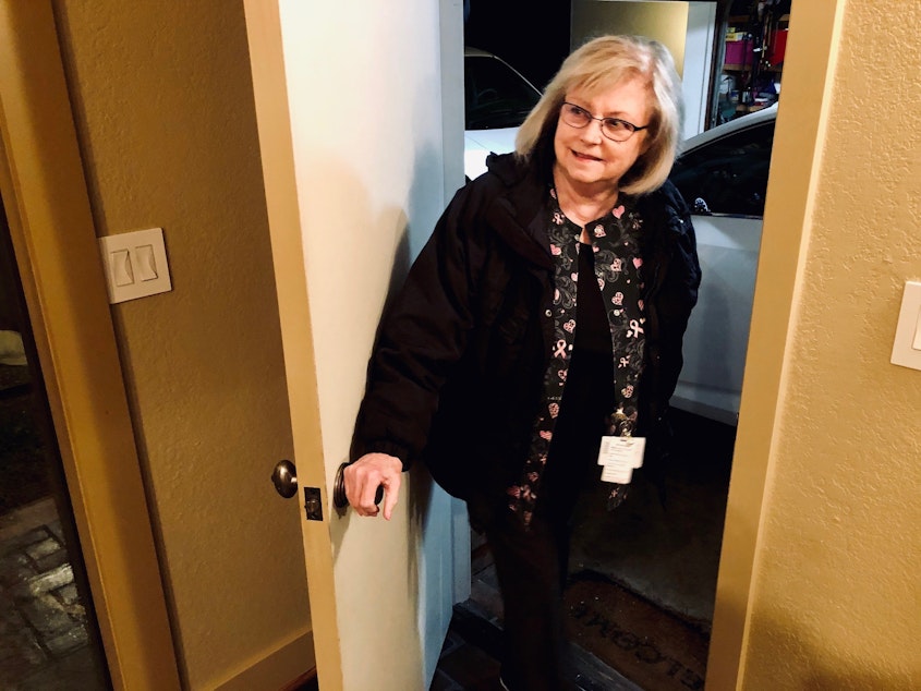 caption: 6:27 AM, March 16, 2020. Bellevue, WA nurse Kathy Leong heads out the door to go work during the COVID-19 pandemic.