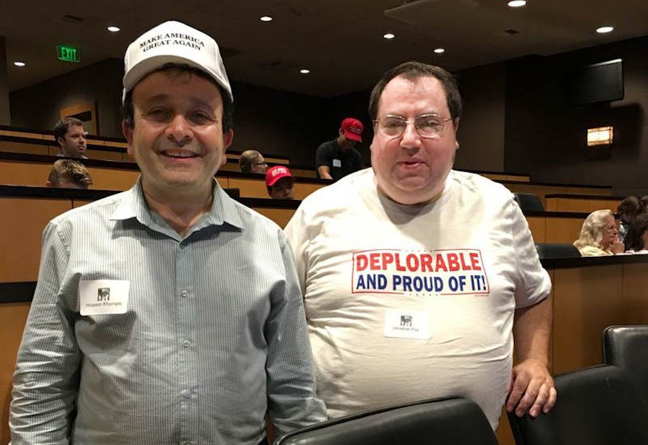 caption: Hossein Khorram (left) at a Republican viewing party of a presidential debate in Bellevue, Washington.