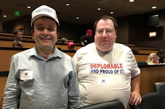 caption: Hossein Khorram (left) at a Republican viewing party of a presidential debate in Bellevue, Washington.