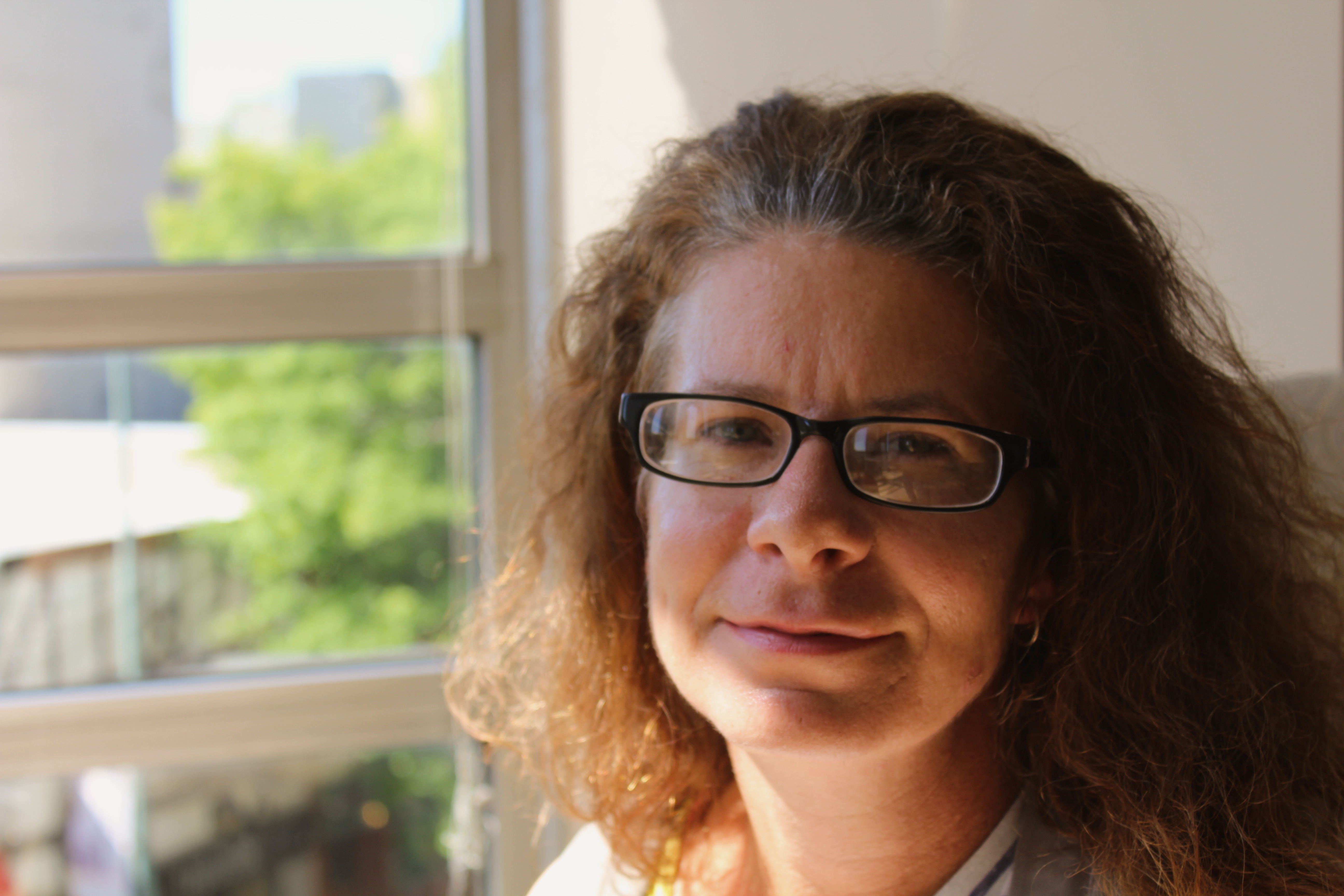 caption: Rebecca Massey at the KUOW studios. 